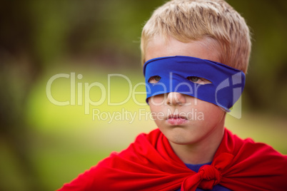 Little boy pretending to be superhero