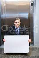 Businessman holding a signboard