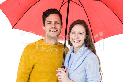 Happy couple holding an umbrella