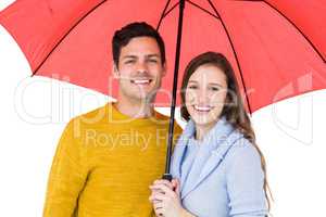 Happy couple holding an umbrella