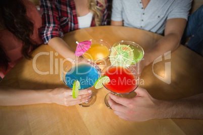 Friends toasting with cocktails