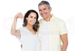 Portrait of happy couple holding home keys
