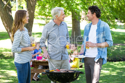 Family having a picnic with barbecue