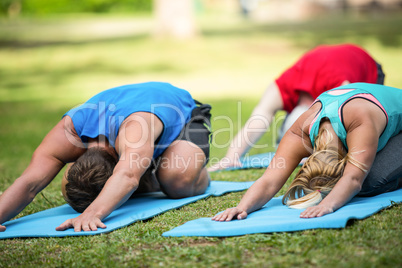 Fitness class practicing yoga