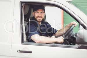 Delivery man driving his van