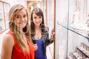 Portrait of two beautiful women in a jeweler shop
