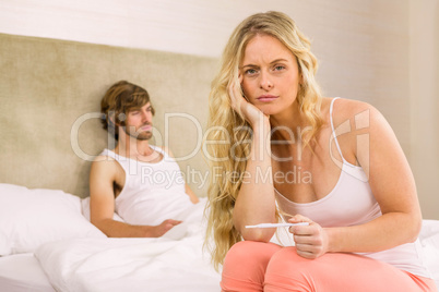 Worried woman waiting the pregnancy test result