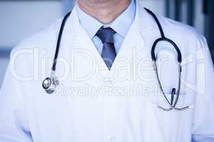 Male doctor in lab coat wearing stethoscope around neck