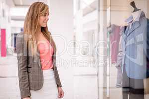 Beautiful woman window shopping