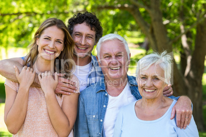 Smiling family hugging