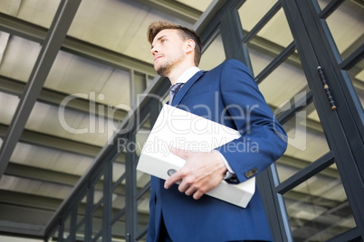 Businessman holding file with documents