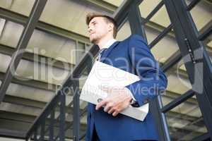 Businessman holding file with documents