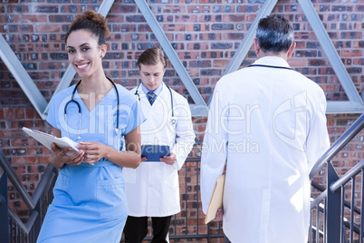 Doctors walking on staircase