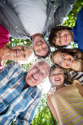 Smiling family with their heads in a circle