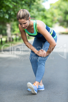 Sportswoman stretching her legs