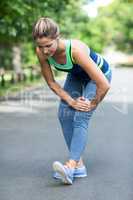 Sportswoman stretching her legs