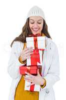Pretty brunette holding several gifts