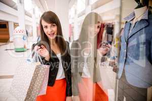 Portrait of woman holding shopping bags