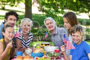 Family with American flag having a picnic