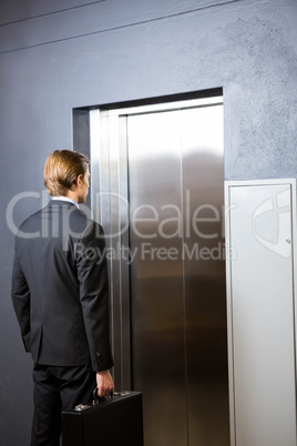 Businessman waiting for elevator