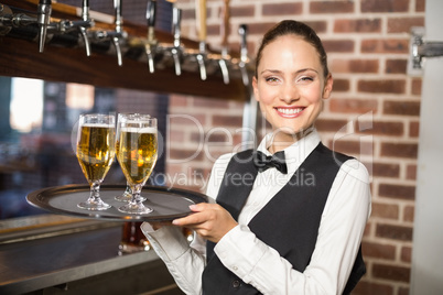 Barmaid serving beer