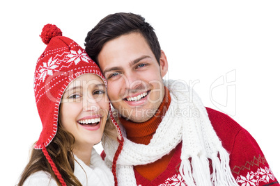 Happy couple with winter clothes embracing head to head