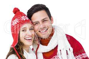 Happy couple with winter clothes embracing head to head