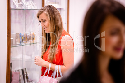Woman looking at wrist watches in display