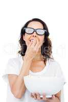 Pretty woman with 3D glasses eating popcorn