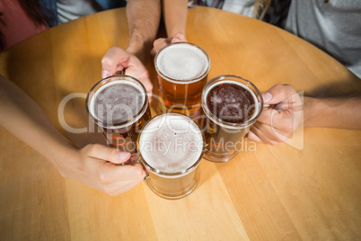 Friends toasting with beers