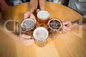 Friends toasting with beers