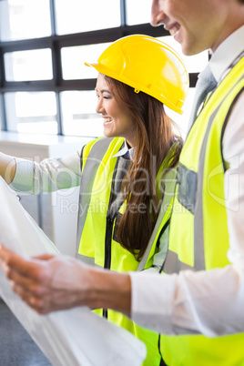 Architects looking at blueprint