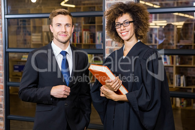 Businessman standing with lawyer near library