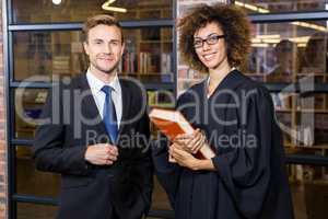 Businessman standing with lawyer near library