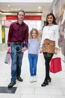 Portrait of happy family with shopping bags