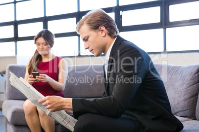 Businessman reading a newspaper