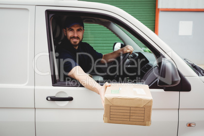 Delivery man sitting in his van