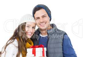 Happy couple holding gift box together