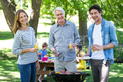 Family having a picnic with barbecue