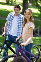 Smiling couple with their bikes