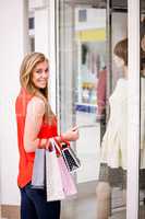 Portrait of beautiful woman window shopping