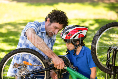 Father and son fixing the bike