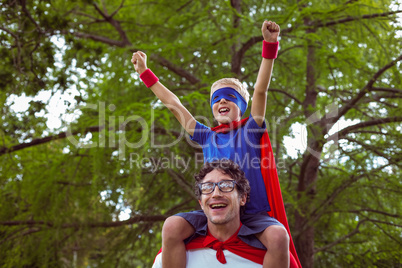 Father and son dressed as superman