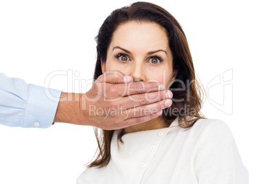 Man covering wifes mouth