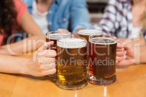 Friends toasting with beers