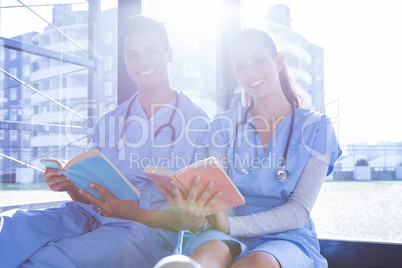 Medical team reading book