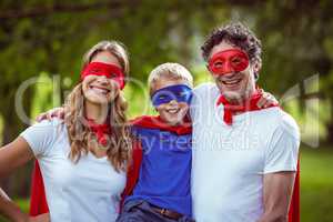 Happy family pretending to be superhero