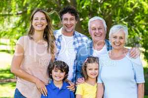 Smiling family hugging