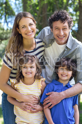 Smiling family standing