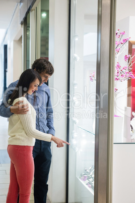 Happy couple shopping in mall